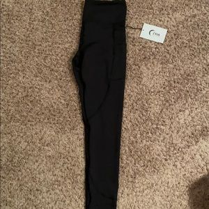 NWT, ZYIA black pocket light n tight! Size 4